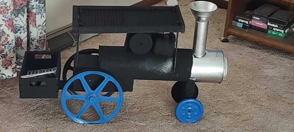 Steambeary the engineer on his Baker Steam Engine